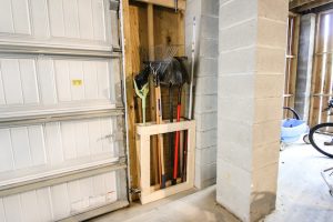 DIY Wall-Mounted Yard Tool Organizer - Image 1